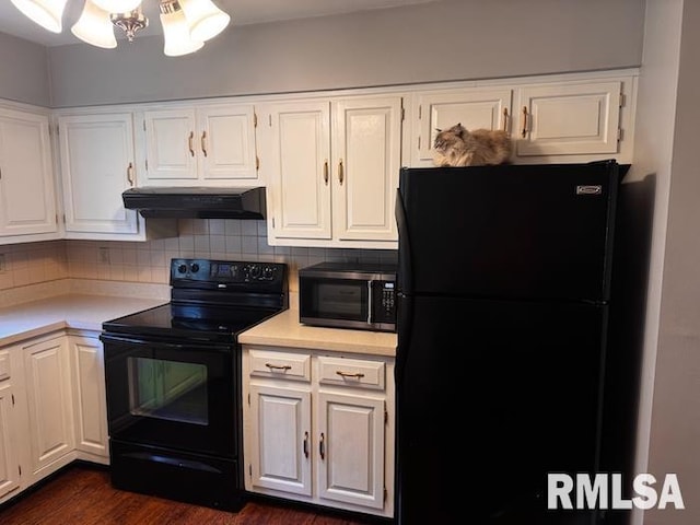 1415 E Sycamore St, Canton, IL 61520 - kitchen with black appliances, exhaust hood, light countertops, white cabinetry, and tasteful backsplash