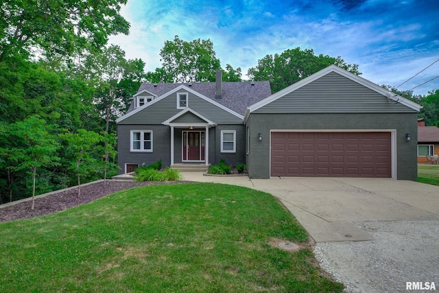 2129 Fondulac Dr, East Peoria, IL 61611 - view of front of property featuring brick siding, a front yard, and driveway