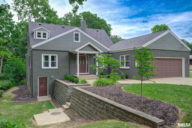 2129 Fondulac Dr, East Peoria, IL 61611 - view of front of home featuring brick siding, a chimney, an attached garage, a shingled roof, and driveway
