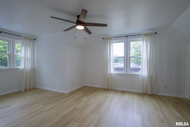 2129 Fondulac Dr, East Peoria, IL 61611 - empty room with light wood-style flooring, plenty of natural light, ceiling fan, and lofted ceiling