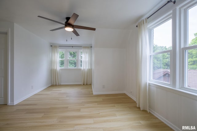 2129 Fondulac Dr, East Peoria, IL 61611 - empty room with light wood-style flooring and a ceiling fan