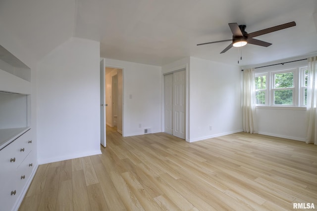 2129 Fondulac Dr, East Peoria, IL 61611 - unfurnished living room featuring a ceiling fan and light wood-style flooring