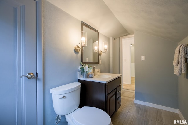 2129 Fondulac Dr, East Peoria, IL 61611 - bathroom featuring lofted ceiling and vanity