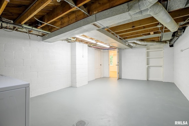2129 Fondulac Dr, East Peoria, IL 61611 - below grade area featuring washer / dryer and concrete block wall