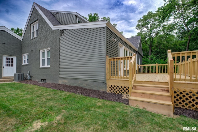 2129 Fondulac Dr, East Peoria, IL 61611 - view of side of home featuring a yard, a wooden deck, a shingled roof, and brick siding