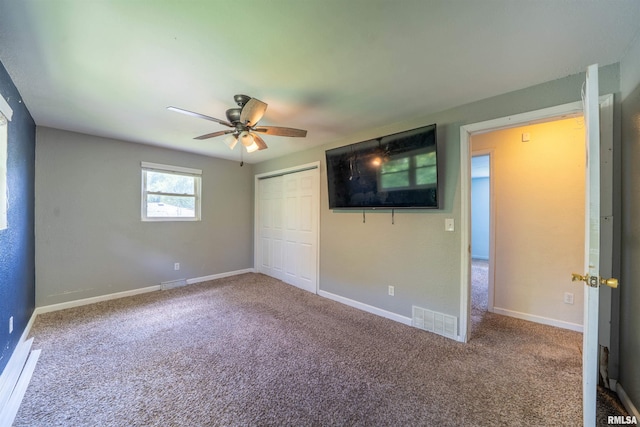 6822 N Kimberly Dr, Peoria, IL 61614 - unfurnished bedroom with carpet, a closet, and ceiling fan