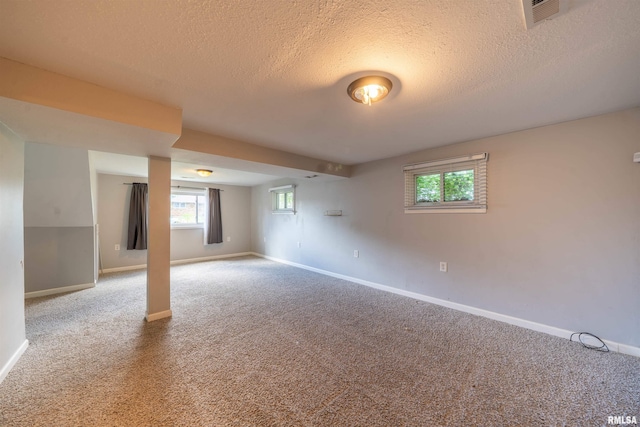 6822 N Kimberly Dr, Peoria, IL 61614 - carpeted empty room with a textured ceiling and plenty of natural light