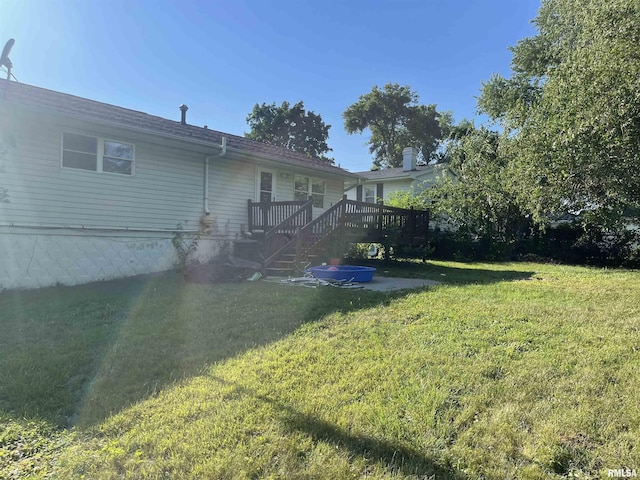 6822 N Kimberly Dr, Peoria, IL 61614 - view of grassy yard featuring a deck and stairs