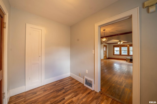 1025 E Maywood Ave, Peoria, IL 61603 - empty room with wood finished floors, a chandelier, and a ceiling fan