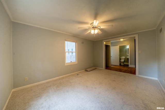 1025 E Maywood Ave, Peoria, IL 61603 - spare room featuring carpet, crown molding, and ceiling fan
