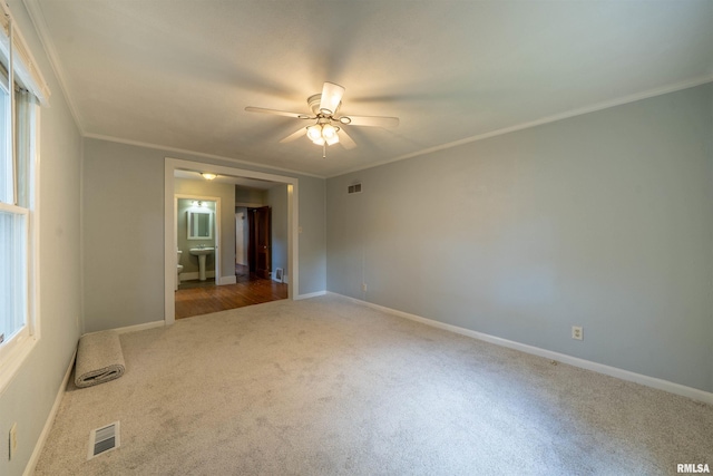 1025 E Maywood Ave, Peoria, IL 61603 - unfurnished room with carpet flooring, a ceiling fan, crown molding, and healthy amount of natural light