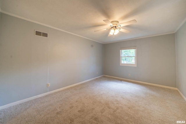 1025 E Maywood Ave, Peoria, IL 61603 - carpeted empty room with crown molding and ceiling fan