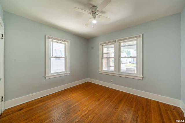 1025 E Maywood Ave, Peoria, IL 61603 - empty room with wood finished floors and ceiling fan