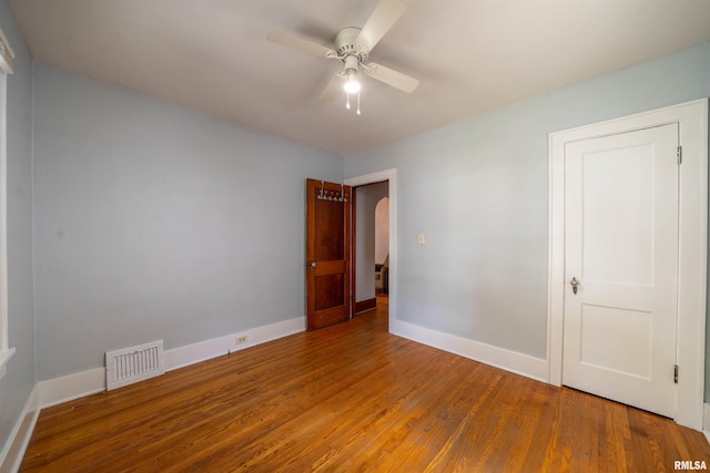 1025 E Maywood Ave, Peoria, IL 61603 - spare room featuring wood finished floors and a ceiling fan