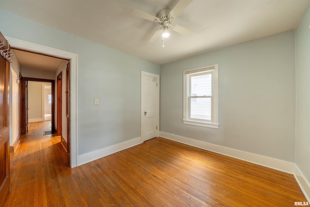 1025 E Maywood Ave, Peoria, IL 61603 - empty room with wood finished floors and ceiling fan