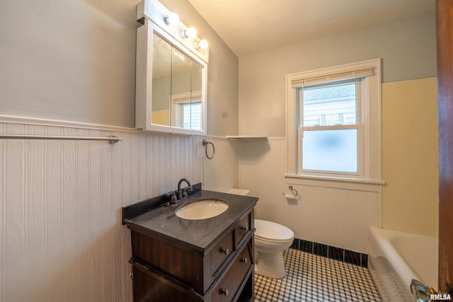 1025 E Maywood Ave, Peoria, IL 61603 - full bath featuring a wainscoted wall, vanity, and a bathtub