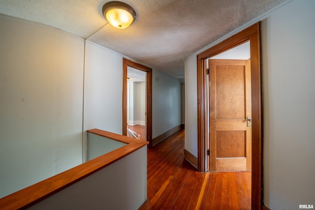 1025 E Maywood Ave, Peoria, IL 61603 - hallway with dark wood finished floors and a textured ceiling