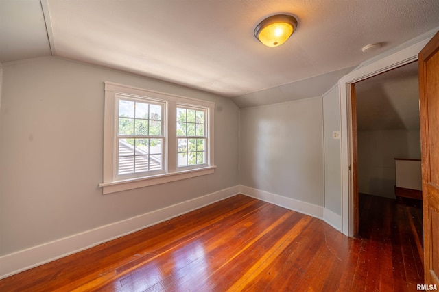 1025 E Maywood Ave, Peoria, IL 61603 - additional living space with lofted ceiling and dark wood-style floors