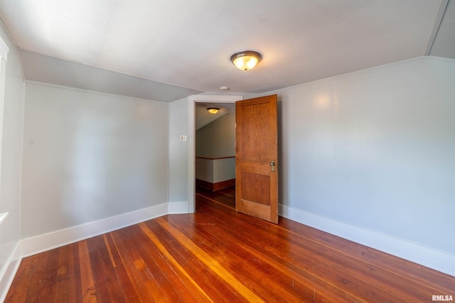 1025 E Maywood Ave, Peoria, IL 61603 - empty room with dark wood-type flooring and lofted ceiling