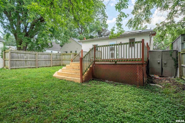 1025 E Maywood Ave, Peoria, IL 61603 - back of property featuring a fenced backyard, a deck, and stairway