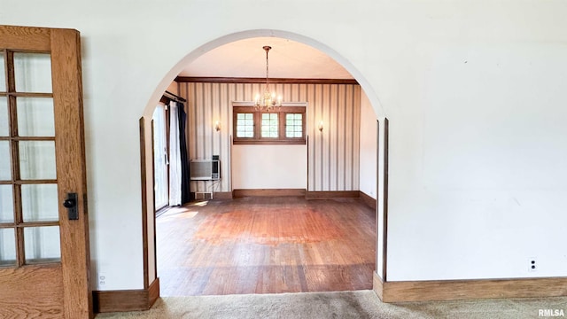 1113 N Summit Blvd, Peoria, IL 61606 - hall featuring a chandelier, arched walkways, and wood finished floors
