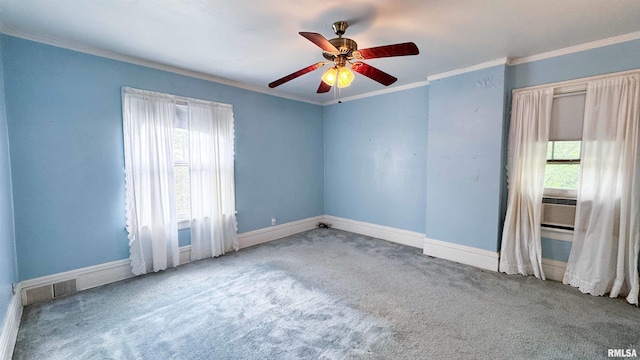 1113 N Summit Blvd, Peoria, IL 61606 - spare room featuring carpet flooring, healthy amount of natural light, crown molding, ceiling fan, and cooling unit