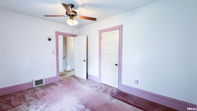 1113 N Summit Blvd, Peoria, IL 61606 - unfurnished bedroom featuring carpet floors, ornamental molding, and a ceiling fan