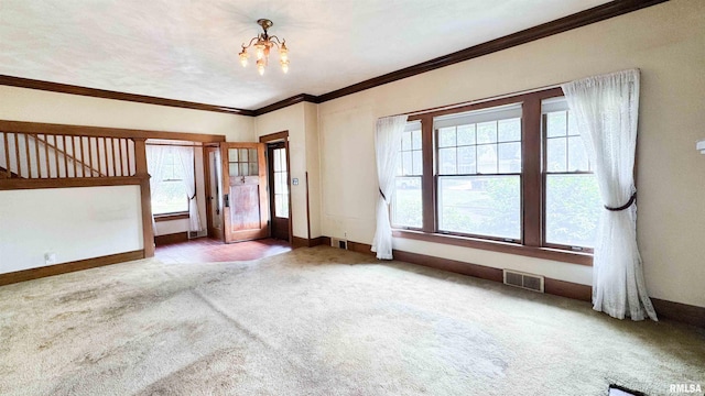 1113 N Summit Blvd, Peoria, IL 61606 - foyer entrance featuring carpet flooring, plenty of natural light, a chandelier, and crown molding