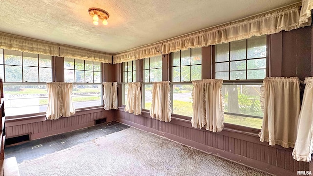 1113 N Summit Blvd, Peoria, IL 61606 - unfurnished sunroom with a textured ceiling