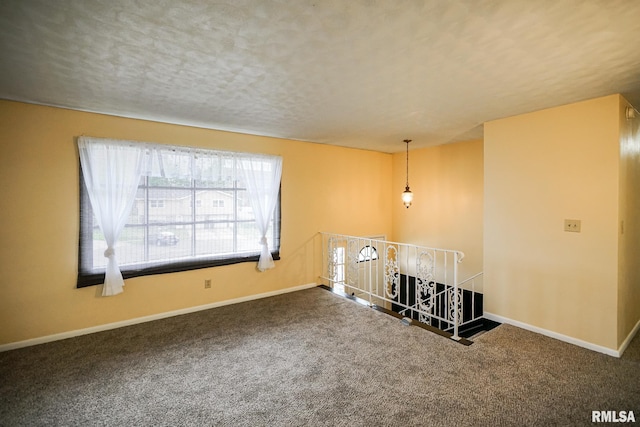 2705 W Millbrook Ct, Peoria, IL 61615 - empty room featuring carpet flooring and a textured ceiling