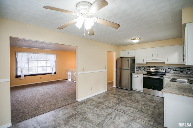 2705 W Millbrook Ct, Peoria, IL 61615 - kitchen with stainless steel appliances, under cabinet range hood, white cabinets, a ceiling fan, and light countertops