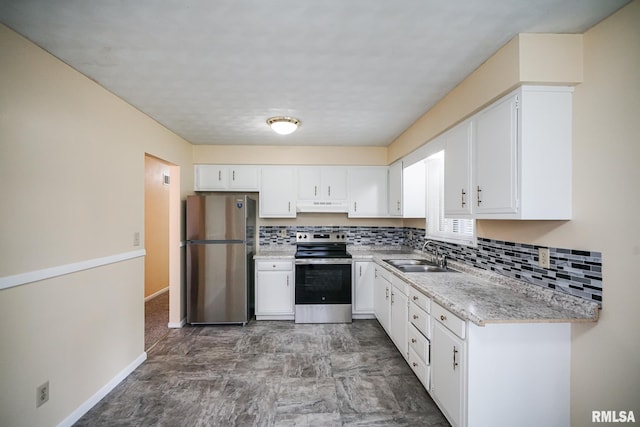 2705 W Millbrook Ct, Peoria, IL 61615 - kitchen with stainless steel appliances, under cabinet range hood, backsplash, and white cabinets