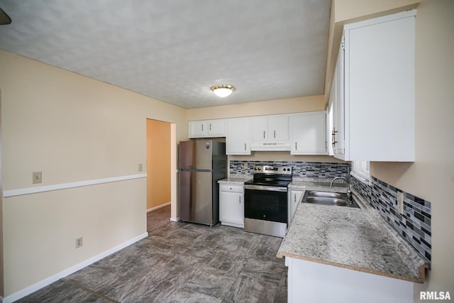 2705 W Millbrook Ct, Peoria, IL 61615 - kitchen with stainless steel appliances, under cabinet range hood, backsplash, and white cabinetry