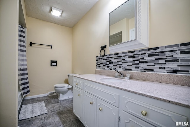 2705 W Millbrook Ct, Peoria, IL 61615 - bathroom featuring backsplash, vanity, and a textured ceiling