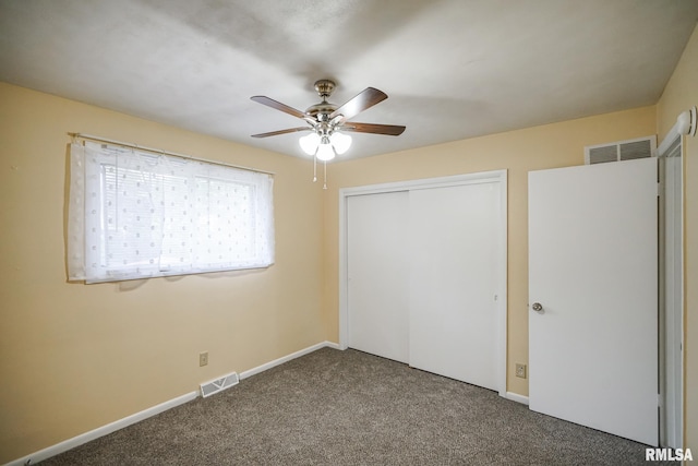 2705 W Millbrook Ct, Peoria, IL 61615 - unfurnished bedroom featuring carpet flooring, a closet, and a ceiling fan
