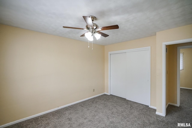2705 W Millbrook Ct, Peoria, IL 61615 - unfurnished bedroom with carpet floors, a closet, and a ceiling fan