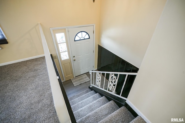 2705 W Millbrook Ct, Peoria, IL 61615 - staircase featuring baseboards and carpet floors