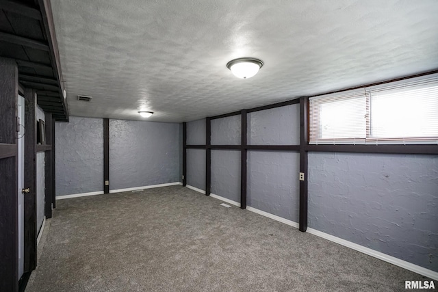2705 W Millbrook Ct, Peoria, IL 61615 - basement featuring a textured wall, a textured ceiling, and carpet flooring