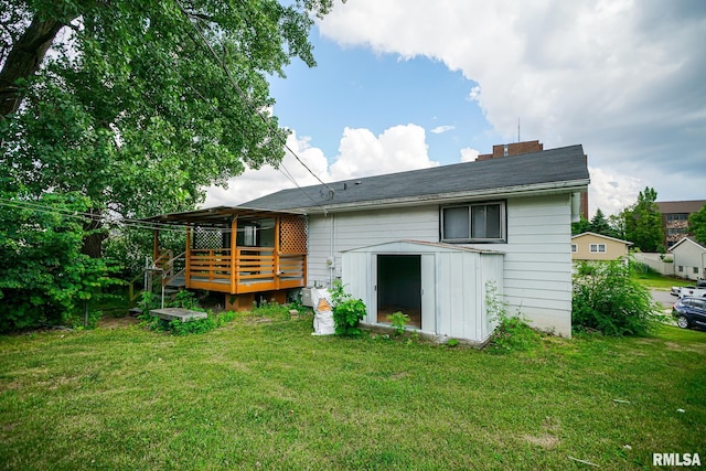 2705 W Millbrook Ct, Peoria, IL 61615 - back of house with a deck, a shed, a yard, and a chimney