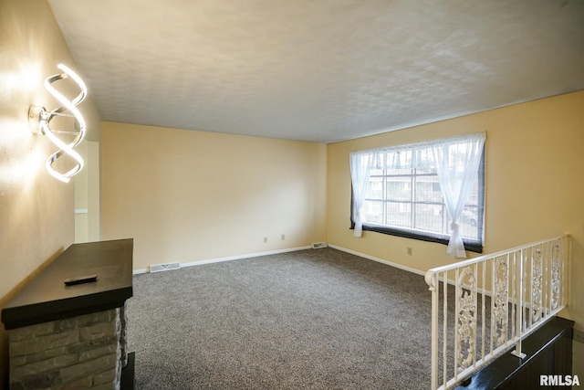 2705 W Millbrook Ct, Peoria, IL 61615 - spare room featuring carpet and a textured ceiling