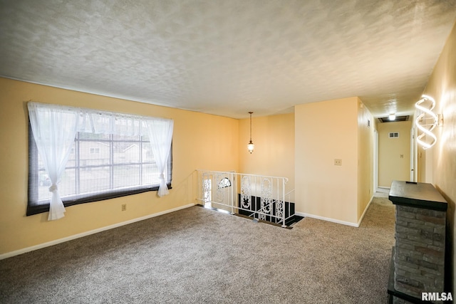 2705 W Millbrook Ct, Peoria, IL 61615 - spare room with carpet flooring and a textured ceiling