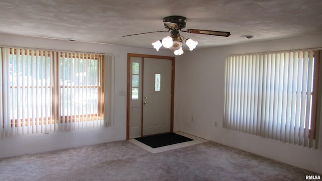 728 Hanna Dr, Pekin, IL 61554 - foyer entrance with carpet floors and ceiling fan