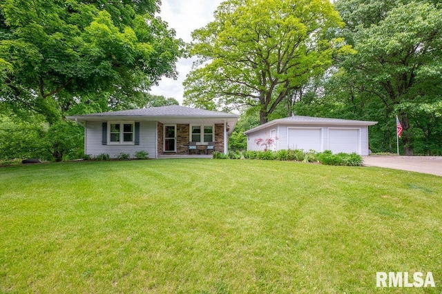 1701 Woodland Knolls Rd, Metamora, IL 61548 - view of front of home featuring a detached garage, an outdoor structure, a front lawn, and covered porch