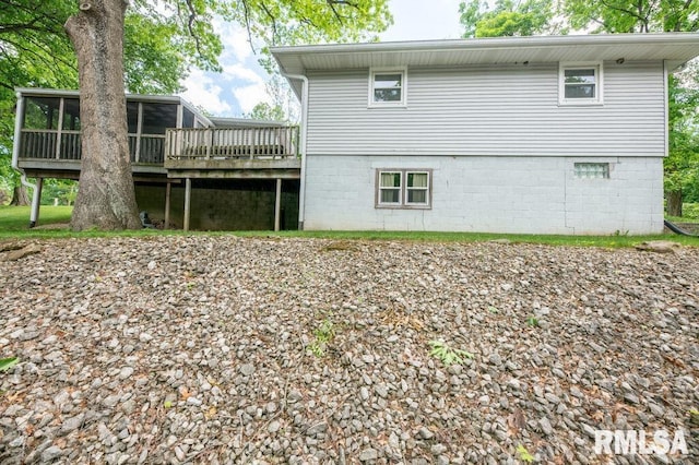 1701 Woodland Knolls Rd, Metamora, IL 61548 - back of property with a sunroom and a deck