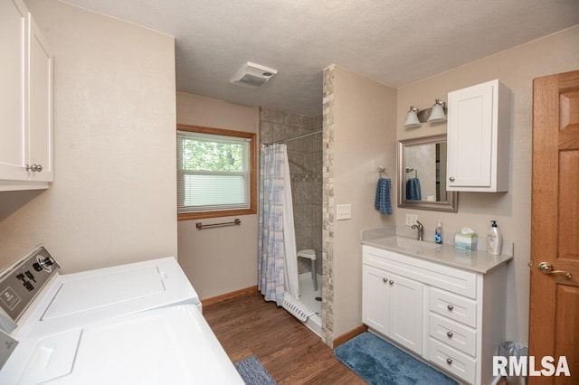 1701 Woodland Knolls Rd, Metamora, IL 61548 - full bathroom featuring a shower stall, independent washer and dryer, wood finished floors, and vanity