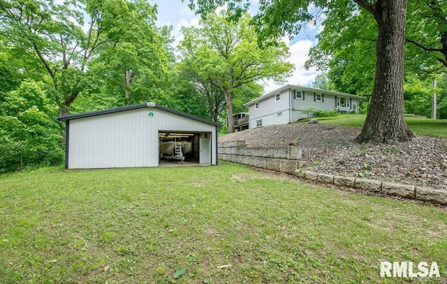 1701 Woodland Knolls Rd, Metamora, IL 61548 - view of grassy yard featuring a pole building, a detached garage, and an outdoor structure