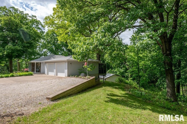 1701 Woodland Knolls Rd, Metamora, IL 61548 - view of front of house with concrete driveway, an attached garage, and a front yard