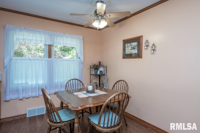 1701 Woodland Knolls Rd, Metamora, IL 61548 - dining room with wood finished floors, a ceiling fan, and crown molding