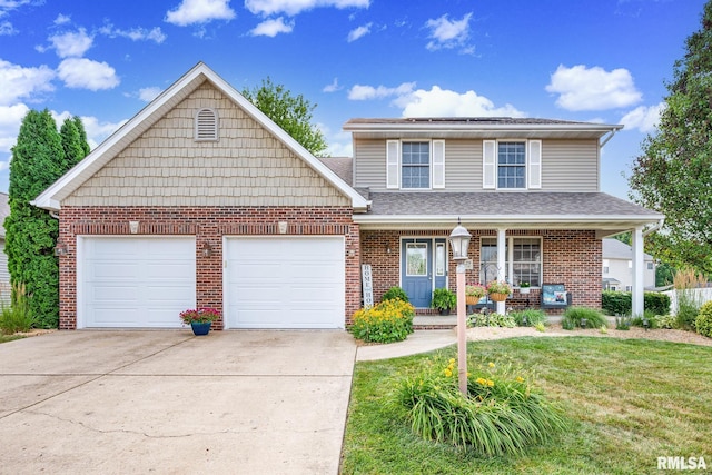 1129 Stonelake Ct, Metamora, IL 61548 - traditional-style home with driveway, brick siding, covered porch, and an attached garage