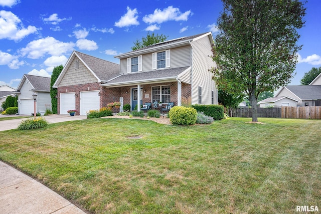 1129 Stonelake Ct, Metamora, IL 61548 - traditional-style home with covered porch, brick siding, an attached garage, concrete driveway, and a shingled roof